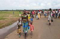 A group of people walking down the street.