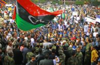 A large group of people gathered together in the street.