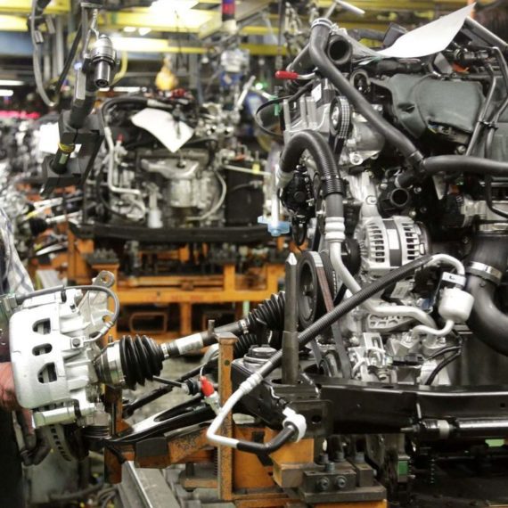 A car engine assembly line with many different types of engines.