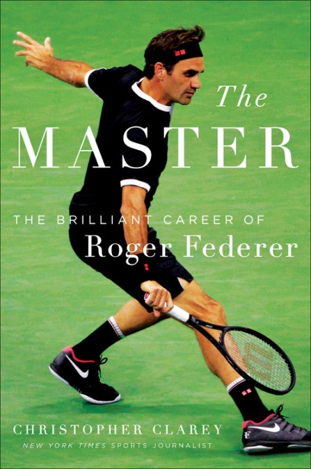 A man holding a tennis racket on top of a green field.