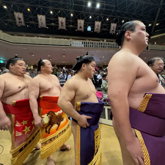 A group of men in traditional sumo wrestling attire.